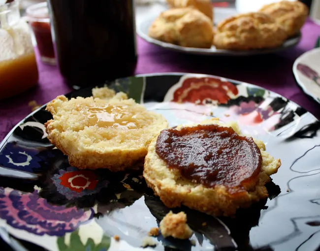 a biscuit with apple butter and honey