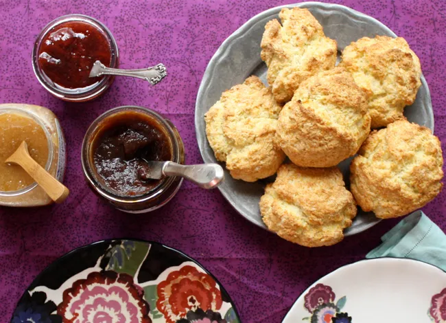 biscuits with apple butter, strawberry jam, and honey