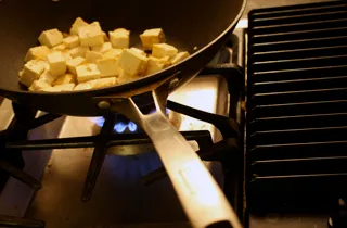 frying tofu cubes for pomegranate-chile tofu