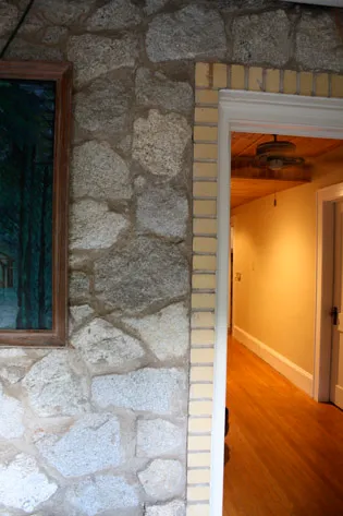 a glimpse into the hallway from the laundry room