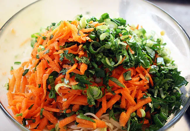 carrots, scallions, and herbs
